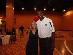 Special guest David Robinson plays on the half court with attendees.